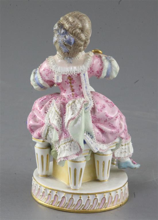 A Meissen figure of a girl seated on a chair, late 19th century, after Acier, height 13.7cm